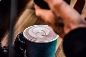 29 Espresso barista creating latte art in a freshly made coffee
