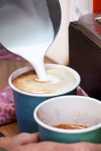 29 Espresso barista preparing freshly brewed coffee