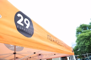 29 Espresso mobile coffee tent serving guests at an event